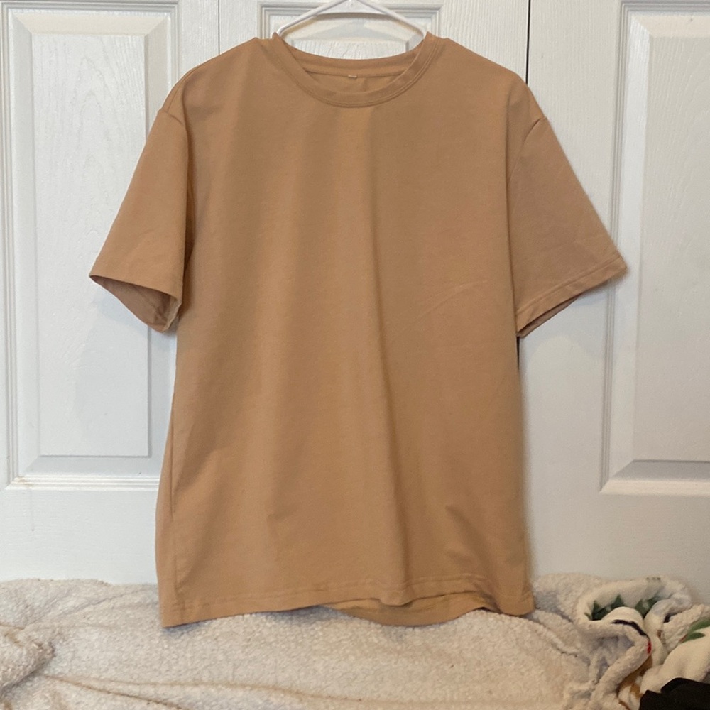 tan-ish pineapple juice shirt